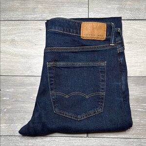 American Eagle Outfitters Blue Jeans with Contrast Stitching and Leather Patch